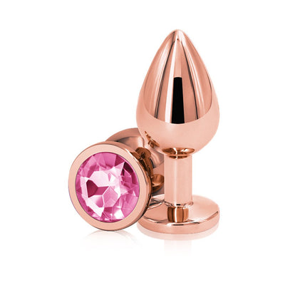 Rose gold medium-sized metal butt plug with a faceted pink gem base, polished and reflective finish.