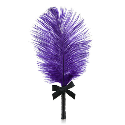 Purple feather tickler with black handle wrapped in ribbon and a small black bow accent.
