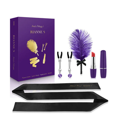 Rianne S Ana's Trilogy Set 1 with purple feather, lipstick vibrator, nipple clamps, and black silk blindfold.