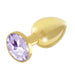 Gold-plated metal butt plug with a faceted light purple gem base, smooth and polished finish.