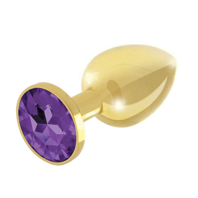 Gold-plated metal butt plug with a faceted purple gem base, smooth and polished finish.