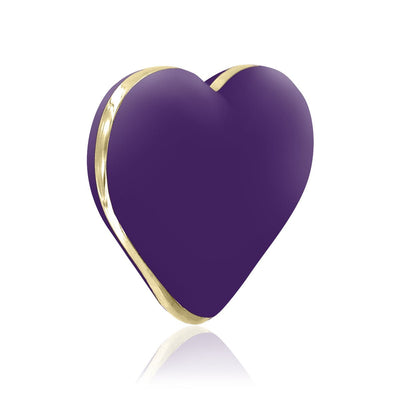 Deep purple heart-shaped vibrator with gold trim, sleek and compact design on white background.