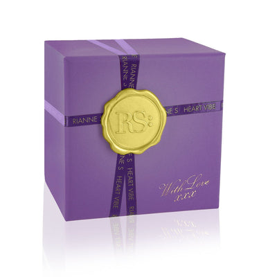 Purple gift box with gold seal and ribbon, elegant packaging for Rianne S Heart Vibe product.