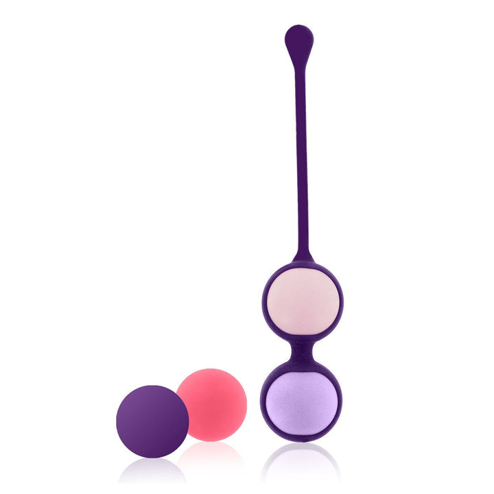 Set of four colorful silicone pelvic floor exercise balls with a purple holder and pull tab for easy use.