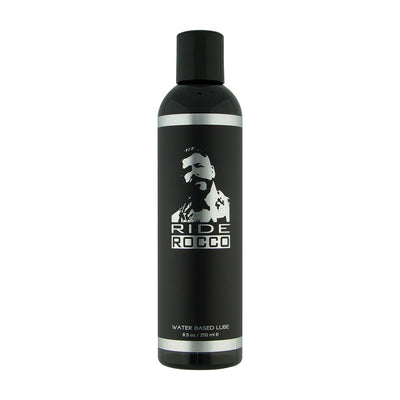 Black 8.5 oz Ride Rocco water-based lubricant bottle with silver accents and logo on white background.