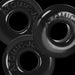 Three black OxBalls Ringer Max rubber rings with embossed branding on a black background.