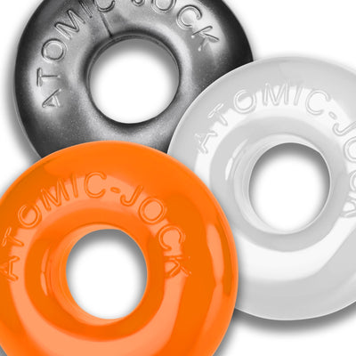 Three colorful OxBalls Ringer Max rubber rings in black, white, and orange with embossed branding.
