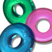 Three translucent colorful stackable rings in green, pink, and blue with embossed branding on each ring.