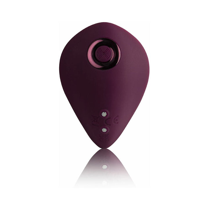 Burgundy teardrop-shaped remote-controlled personal massager with smooth silicone finish and magnetic charging points.