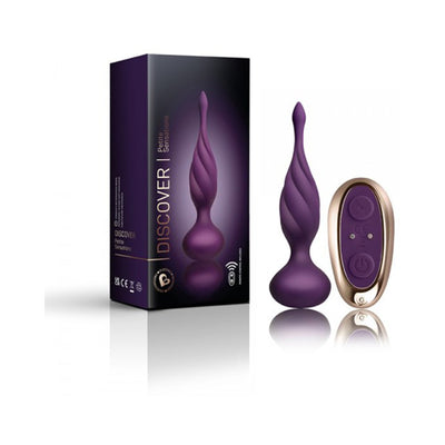 Purple contoured petite plug with tapered neck and matching remote control next to product packaging.