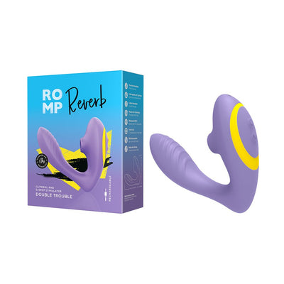 Purple ROMP Reverb dual stimulator with yellow accents next to its blue and purple packaging box.