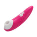 Hot pink Romp Shine clitoral air vibrator with white silicone suction head and two-button control on handle.