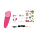 Pink ROMP Shine X personal massager with USB charging cable, user guides, and colorful sticker sheet on white background.