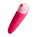 Pink and red ROMP Shine X silicone pleasure device with a smooth, ergonomic design and rounded tip.
