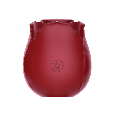 Compact red rose-shaped suction stimulator with soft silicone petals and ergonomic design.