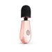 Compact rosy gold mini massager with a soft black head and ergonomic design for easy handheld use.