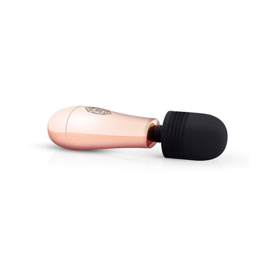Compact rosy gold mini massager with a soft black silicone head and ergonomic handle, ideal for travel and personal use.