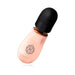 Compact rosy gold mini massager with a soft black silicone head and sleek ergonomic design.
