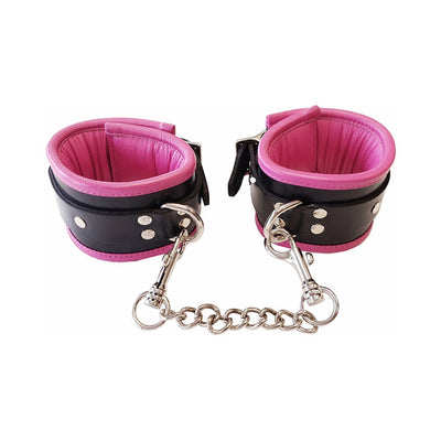Black and pink padded leather wrist cuffs connected by a detachable silver chain with trigger hooks.