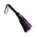 Black short suede flogger with leather handle and purple accents on tails for sensation play and impact.