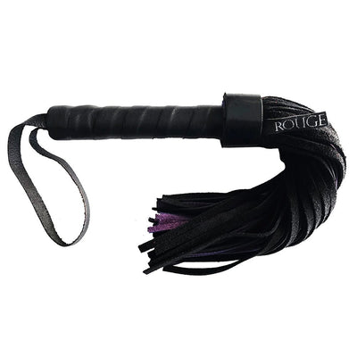Black short suede flogger with wrapped leather handle and wrist strap, featuring multiple suede tails for sensation play.