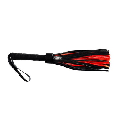 Black and red suede flogger with wrapped leather handle and wrist strap for secure grip.