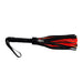 Black and red suede flogger with wrapped leather handle and wrist strap for secure grip.