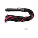 Black and pink suede flogger with a wrapped leather handle and multiple soft straps for versatile use.