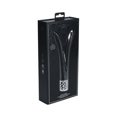 Black V-shaped silicone rechargeable vibrator with silver decorative base in sleek black packaging.