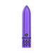 Compact purple rechargeable bullet vibrator with decorative filigree base and sleek metallic finish.