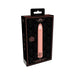 Rose gold rechargeable bullet vibrator with decorative base displayed on black patterned packaging box.