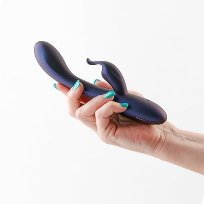 Hand holding a metallic blue Royals Empress Rabbit vibrator with a smooth, curved design and dual stimulation arms.