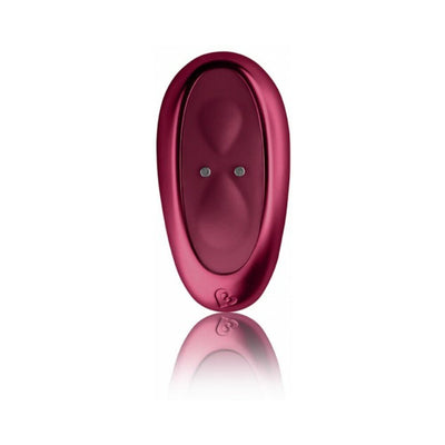 Ruby Glow Rosa Saddle Vibrator in deep pink with smooth ergonomic design and reflective surface on white background.