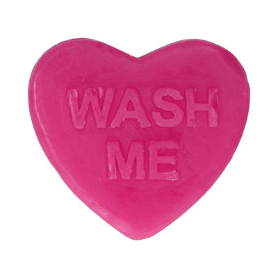 Bright pink heart-shaped soap bar with the words "WASH ME" embossed on the surface.