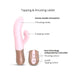 Pink Sassy Bunny vibrator with dual motors, ergonomic handle, and controls for thrusting and tapping modes.
