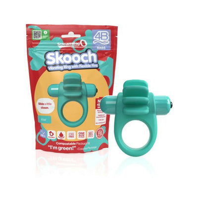Teal 4B Skooch vibrating ring with flexible fins shown next to its colorful compostable packaging.