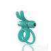 Teal double cockring with flexible rabbit ears and attached bullet vibrator for targeted stimulation.