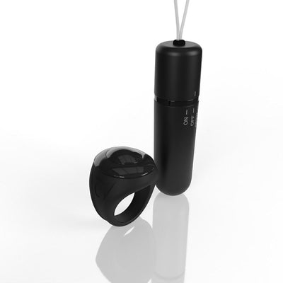 Black remote control ring and compact bullet vibrator with on/off switch on white background.