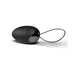 Black remote control vibrating egg with a smooth silicone surface and a looped retrieval cord.