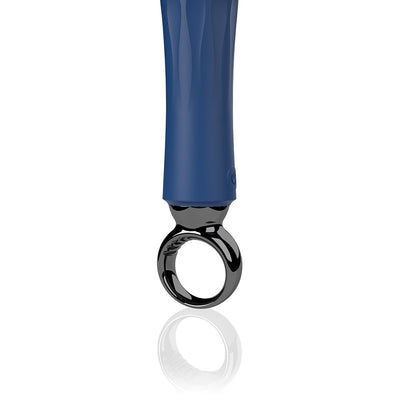 Close-up of the blue Screaming O Primo Wand vibrator showing the ergonomic black ring handle on a reflective surface.