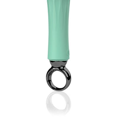 Close-up of the Screaming O Primo Wand handle in mint green with a black circular grip and power button.
