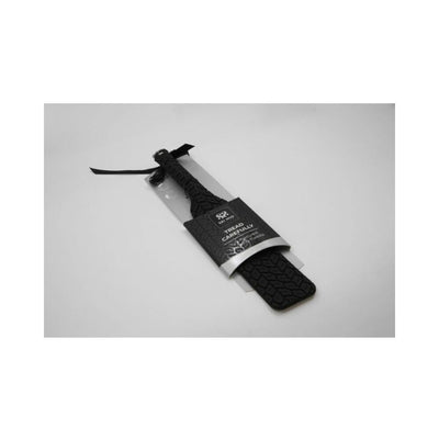 Sei Mio Tyre Paddle Large in black with textured tyre pattern and smooth side, packaged with a wrist strap.