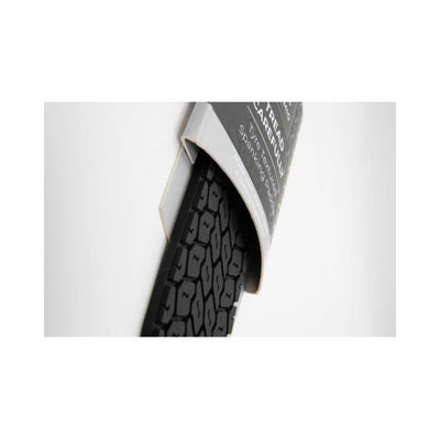 Close-up of Sei Mio Tyre Paddle showing black tyre-textured side partially inside packaging.