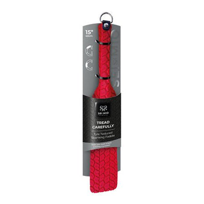 Red vegan leather Sei Mio Tyre Paddle with textured tire pattern, 15-inch double-sided spanking paddle in packaging.
