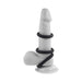 Black silicone 3-ring cock ring set displayed on a white anatomical model with suction base.