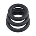 Set of three black silicone cock rings in varying sizes stacked on a white background.