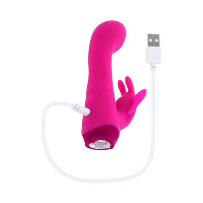 Pink silicone Selopa Butterfly Love vibrator with USB charging cable connected, shown on white background.