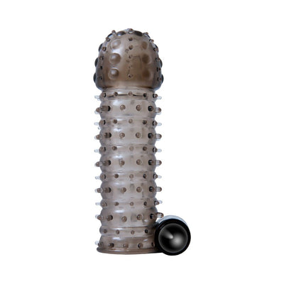 Clear smoky textured sleeve with raised nodules and a small black vibrating bullet beside it.