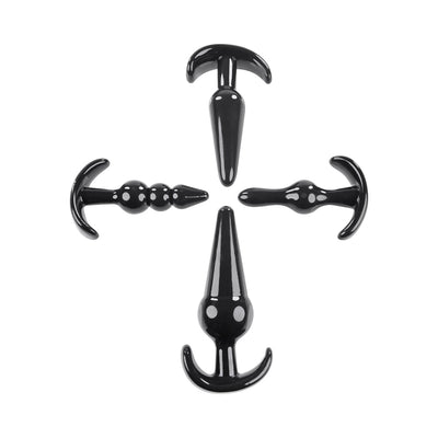 Set of four black anal plugs in different shapes and sizes with tapered tips and wide bases, arranged in a cross formation.