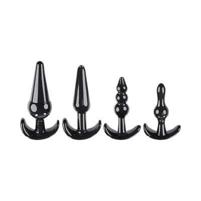 Set of four black anal plugs in varying shapes and sizes with wide bases for safe use, displayed on a white background.